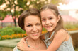 © aletia2011 - Portrait of happy mother and daughter smiling outdoors