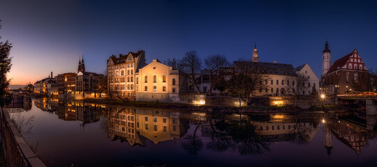 Sticker - Closeup shot of the building Opole reflection on the river canal, Poland