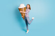 Full size photo of young funky funny girl hug embrace huge ice cream show tongue lick isolated on blue color background