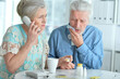 © aletia2011 - Sick senior couple calling to doctor