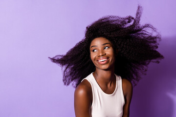 Wall Mural - Portrait of attractive cheerful dreamy girl air blowing hair good mood isolated over bright violet purple color background