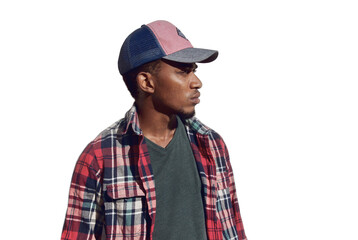 Wall Mural - Portrait of young african man looking away wearing a baseball cap, red plaid shirt isolated on a white background