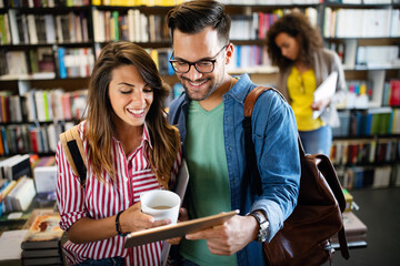 Wall Mural - Young university students studying together. Group of multiracial friends in college