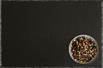 Canvas Print - bowl with pepper on black