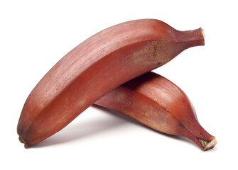 ripe tropical tasty red bananas on white background