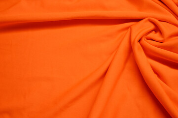orange textile pattern as a background. orange material texture on fabric
