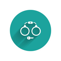 Canvas Print - White Handcuffs icon isolated with long shadow. Green circle button. Vector