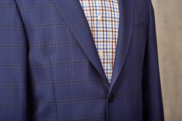 Wall Mural - Men's casual checkered tweed coat and shirt lapel closeup