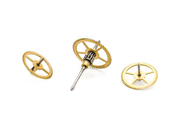 Gears from clock isolated on white background. Photo with shallow depth of field.