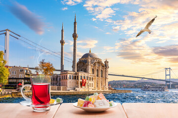 Wall Mural - The Bosphorus bridge, Ortakoy Mosque and turkish tea, Istanbul