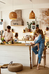 Wall Mural - happy family with their children cooking in the kitchen