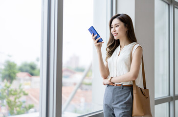 Poster - businesswoman use smart phone