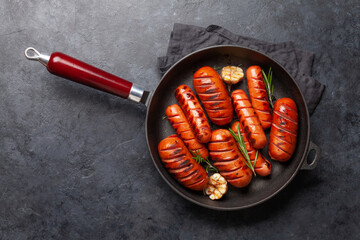 Canvas Print - Hot grilled sausages in a frying pan