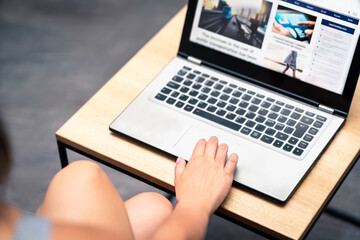 News website design or blog graphic update testing with laptop. Online web page designer, editor or coder working. Responsive site layout by professional UI and UX developer. Www press portal launch.