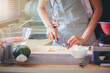 © Panumas - Happiness Asian couple cooking together in the kitchen at home.