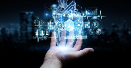 Fototapete - Man hand using digital x-ray of human heart holographic scan projection 3D rendering