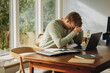 © Jacob Lund - Man feeling disappointed while working on laptop