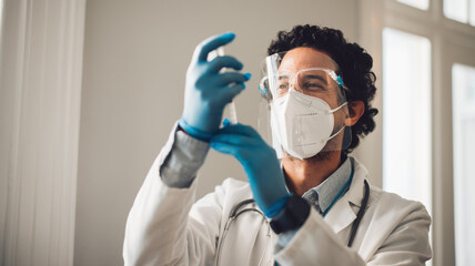 Doctor preparing covid-19 vaccine injection