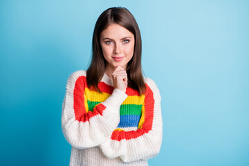 Poster - Photo of charming thoughtful young woman dressed striped sweater arm chin empty space smiling isolated blue color background