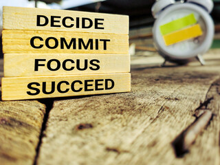 Wall Mural - Inspirational and Motivational Concept text decide commit focus succeed background. Stock photo.