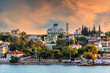 Salamis Island, Attica, Greece. The Assumption of Virgin Mary holy church in Salamis island, as seen from the ferry boat (route Piraeus - Salamis). Sunset, colorful cloudy sky