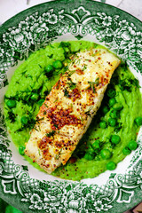 Canvas Print - Sauteed cod with pea cream..style rustic