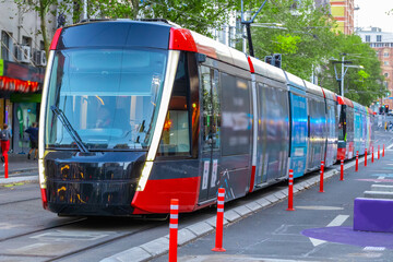 Tram moving through George St in Sydney NSW Australia