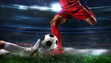 Close Up Of A Football Action Scene With Competing Soccer Players At The Stadium