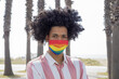 Portrait of a young African man wearing pride mask - LGBT during the pandemic