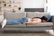 © Prostock-studio - Exhausted Sleepless Young Woman Lying On The Couch
