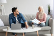 © Prostock-studio - Young arab couple looking for health insurance on Internet