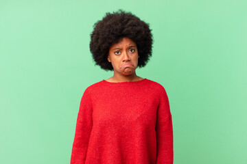 afro black woman feeling sad and whiney with an unhappy look, crying with a negative and frustrated attitude