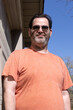 Young Man With Gray Beard Wearing Sunglasses