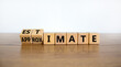 Estimate or approximate symbol. Turned wooden cubes and changed the word 'approximate' to 'estimate'. Beautiful wooden and white background, copy space. Business, estimate or approximate concept.