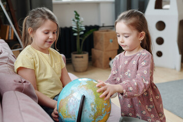 Wall Mural - Girls studying geography together