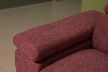 Wall Mural - Detail of a red design fabric sofa in the room