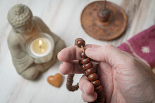 Using Prayer Beads Or A Mala To Count Mantra Recitations During Meditation