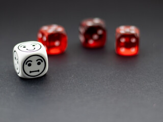 red dice and white smile dice