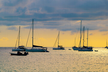 Yacht boat sailing boats or Travel boats in Beautiful open sea at sunset golden sky Amazing for summer holiday background and Travel destination or Website