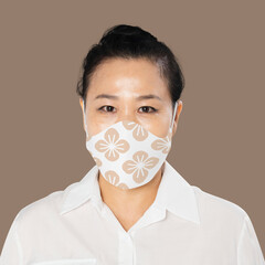 Canvas Print - Mature woman wearing floral face mask in the new normal