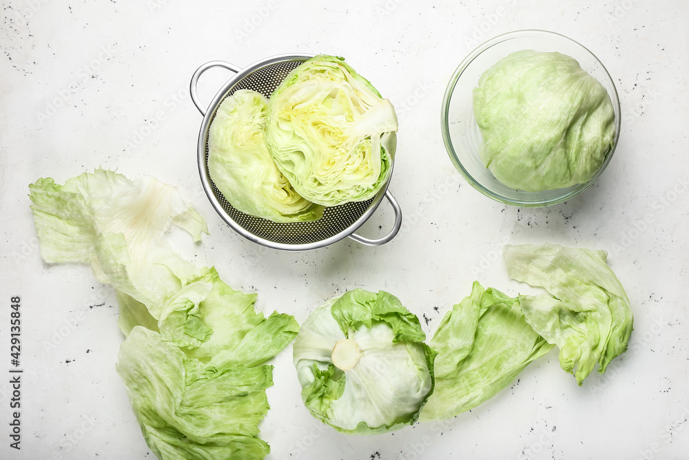 Fresh iceberg lettuce on light background