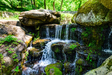 Wall Mural - Beautiful waterfall on small river in a park