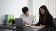 © Prathankarnpap - Business people discussing work and analyzing some document at office.