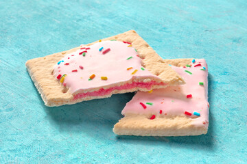 Pop tart, broken, on a blue background