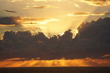 colorful sunset over the sea on the tropical island of La Réunion, France