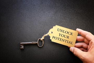 unlock your potential concept. vintage key with tag