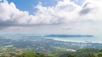Wall Mural - Phuket cityscape from viewpoint on top of Nagakerd Mountain. Famous destination for tourist, Thailand; zoom out - Time Lapse