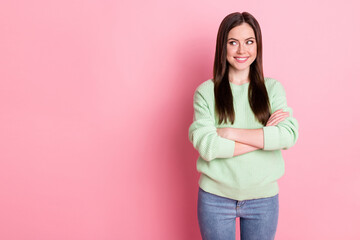 Poster - Photo of satisfied young girl folded hands look empty space light green sweater isolated on pink color background