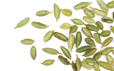 Green cardamom pods pile isolated on white background, top view