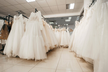 Wedding dresses in bridal salon in mall